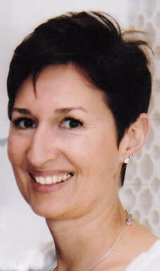woman with short hair, smiling